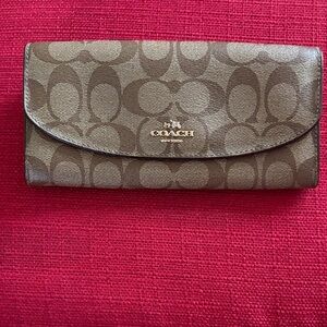 Coach Tan Signature Wallet with stylish pink interior